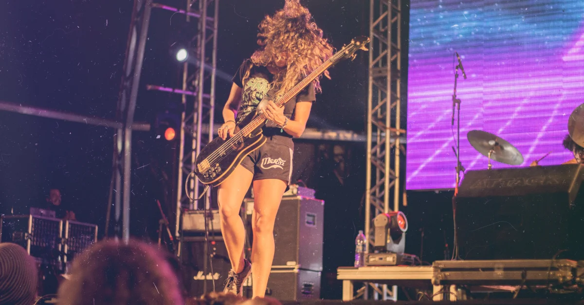 Guitaralize Female Bass Player on Stage